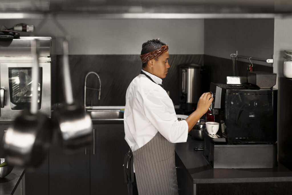Barista crafting a masterpiece on a sophisticated black Jura coffee machine